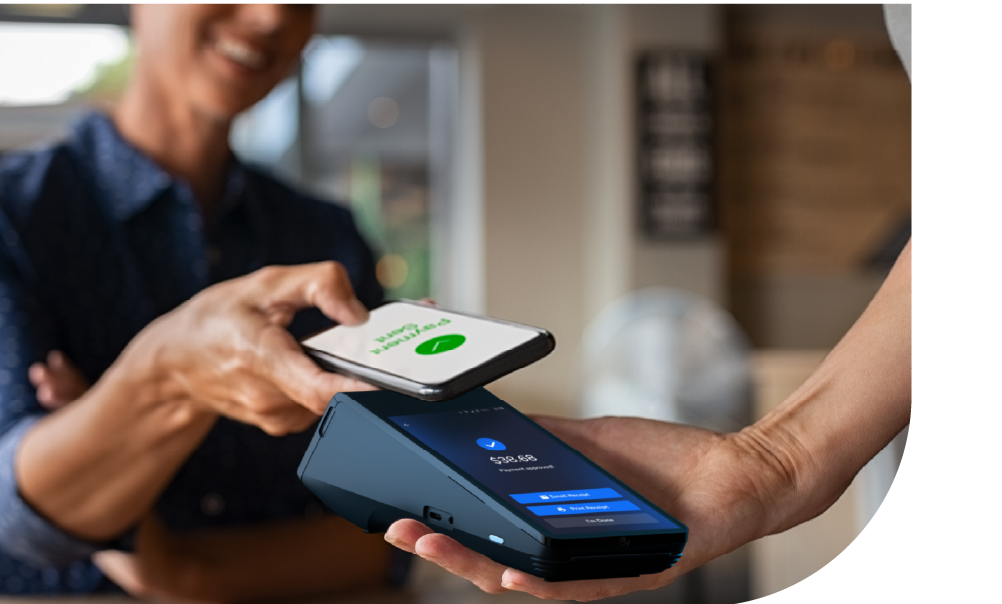 Customer making a contactless mobile payment on a portable card machine